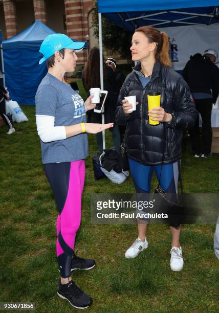 Actors Erin Cummings and Scottie Thompson attend the "Power Of Tower" run/walk at UCLA on March 11, 2018 in Los Angeles, California.