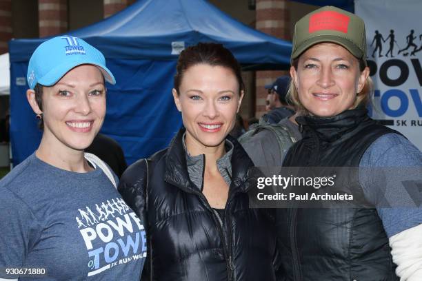 Actors Erin Cummings, Scottie Thompson and Zoe Bell attend the "Power Of Tower" run/walk at UCLA on March 11, 2018 in Los Angeles, California.