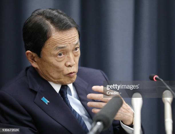 This picture taken on March 9, 2018 shows Japan's Finance Minister Taro Aso speaking a press conference following the resignation of the head of the...