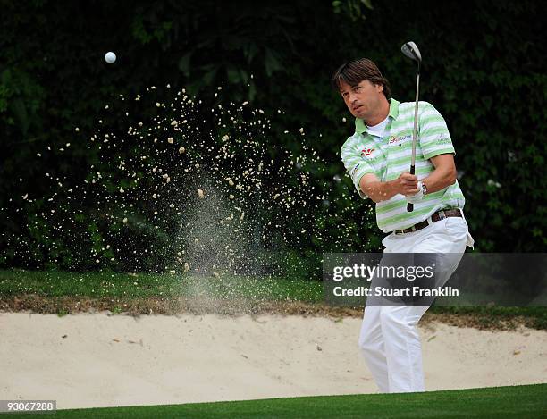 Robert Jan Derksen of The Netherlands plays his bunker shot on the 11th hole during the final round of the UBS Hong Kong Open at the Hong Kong Golf...