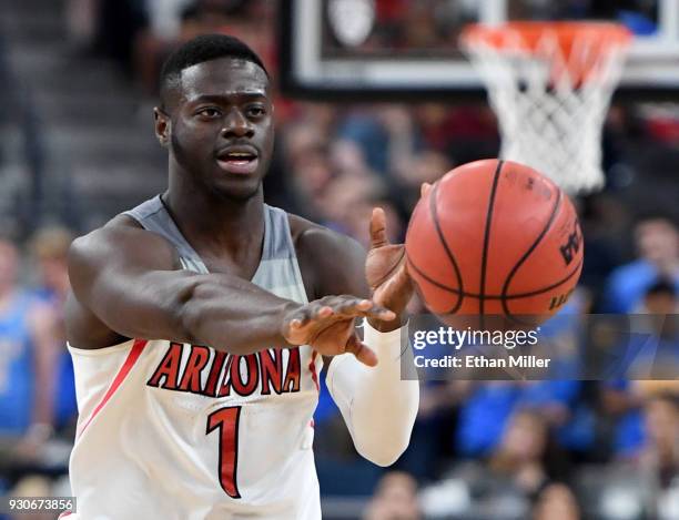 Rawle Alkins of the Arizona Wildcats passes against the UCLA Bruins during a semifinal game of the Pac-12 basketball tournament at T-Mobile Arena on...