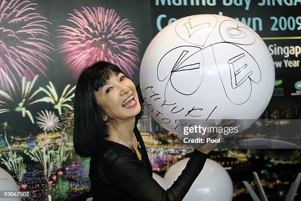 Miyuki Hatoyama, wife of Japan's Prime Minister Yukio Hatoyama, laughs during a spouse's tour following the APEC Summit on November 15, 2009 in...