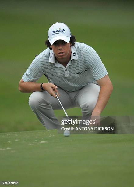 Rory McIlroy of Northern Ireland lines up a putt during the final round of the Hong Kong Open golf tournament at the Hong Kong Golf Club in Fanling...