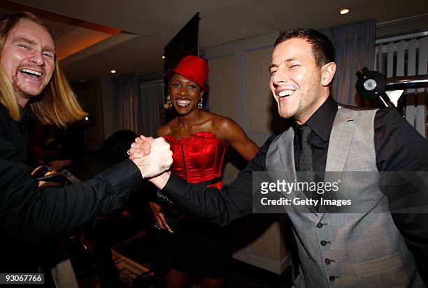 Lee Latchford-Evans, former band member of group Steps, greets Natasha Danvers and friend during the 2009 British Athletics Writers Association...