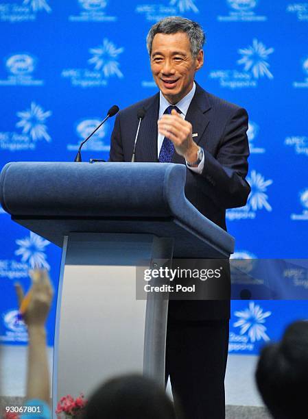 Singapore's Prime Minister Lee Hsien Loong and Chairman of the 17th APEC Leader's Meeting answers questions from the press at Suntec Singapore...