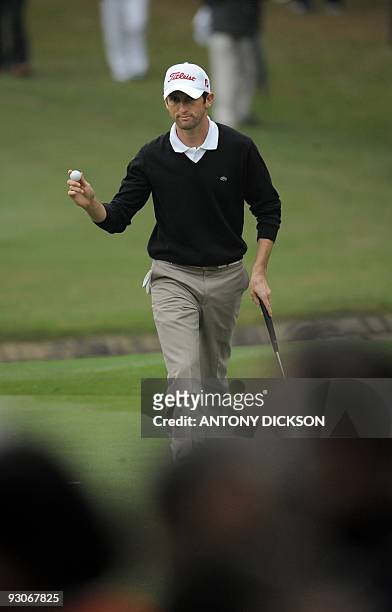 France's Gregory Bourdy acknowledges the crowd during the final round of the Hong Kong Open golf tournament at the Hong Kong Golf Club in Fanling on...