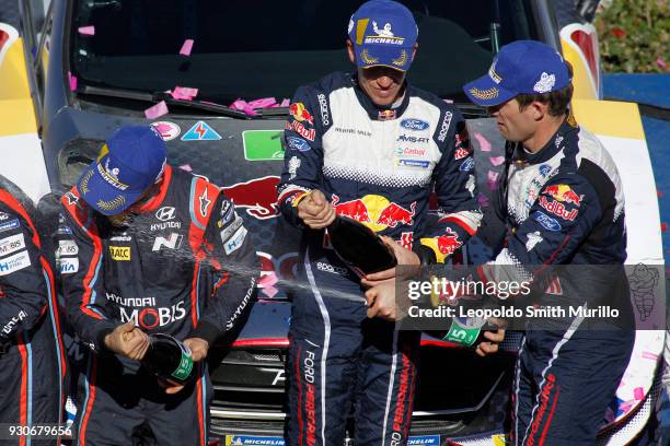 Dani Sordo from Spain second position, Julien Ingrassia and Sebastien Ogier from France celebrates the first position during the FIA World Rally...