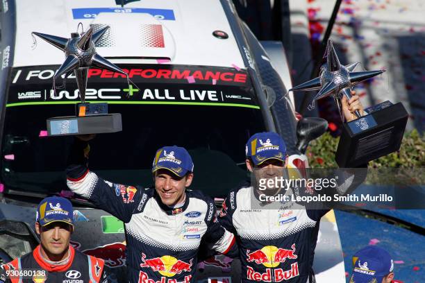 Julien Ingrassia and Sebastien Ogier of France lift their trophies to celebrate the first position during the FIA World Rally Championship Mexico...