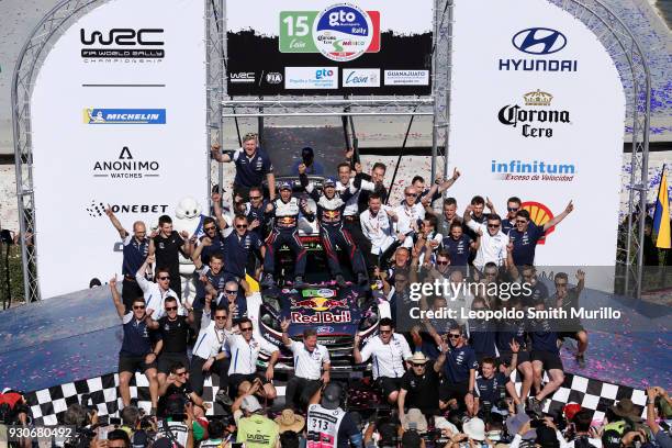 Julien Ingrassia and Sebastien Ogier of France celebrate with team members the first position during the FIA World Rally Championship Mexico 2018 on...