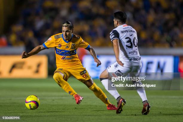 Ismael Sosa of Tigres fights for the ball with Hiram Muñoz of Tijuana during the 11th round match between Tigres UANL and Tijuana as part of the...