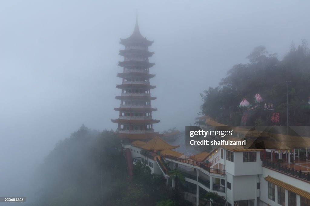 The Chin Swee Caves Temple over clouds and heavy fog. The temple is situated in the most scenic site of Genting Highlands, Malaysia. Within the Temple is seated a statue of Qingshui, a Buddhist monk who has long been referred to as a deity.