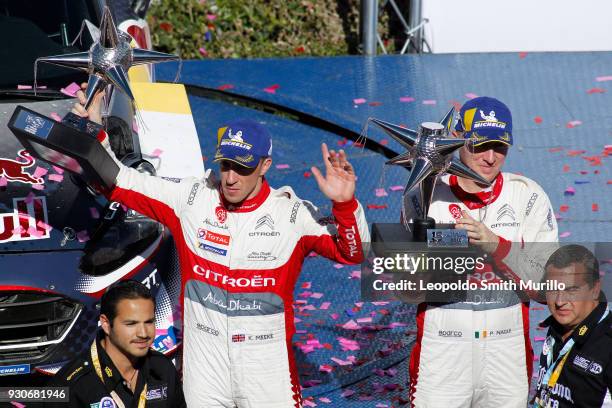 Kris Meeke and Paul Nagle lift their trophies to celebrate the third position during Day Four of the FIA World Rally Championship Mexico 2018 on...