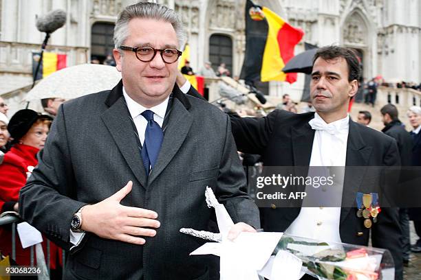 Prince Laurent of Belgium receives flowers after a Te Deum mass, marking the King's feast, at the Saint Michael and Saint Gudula Cathedral in...