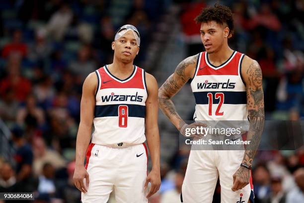 Tim Frazier of the Washington Wizards and Kelly Oubre Jr. #12 of the Washington Wizards stand on the court during the second half of a NBA game...