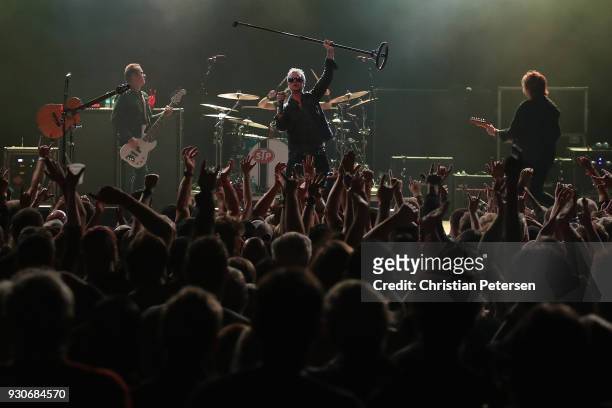 Singer Jeff Gutt , guitarist Dean DeLeo , bass player Robert DeLeo and drummer Eric Kretz of Stone Temple Pilots perform at Marquee Theatre on March...