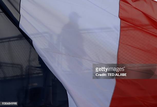 An armed French sailor of the navy frigate Vendemiaire is seen as it prepares to dock at the international port in Manila on March 12, 2018. FNS...