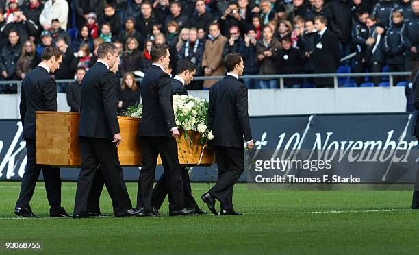 Players of Hannover 96 carry out the coffin of Robert Enke during the memorial service prior to Robert Enke's funeral at AWD Arena on November 15,...