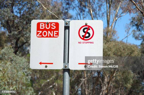 bus zone and no stopping signs - australian bus driver stock-fotos und bilder