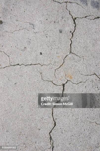 cracked concrete footpath - broken concrete stock pictures, royalty-free photos & images