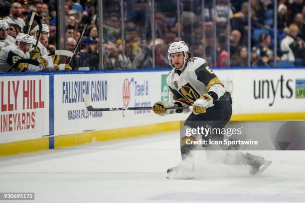 March 10: Vegas Golden Knights defenseman Colin Miller shoots the puck around the boards during an NHL game between the Vegas Golden Knights and...