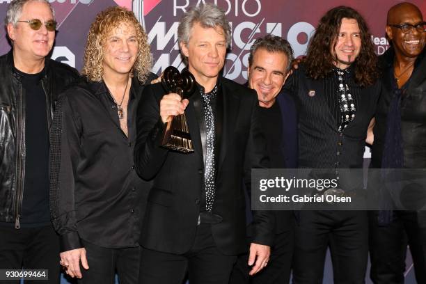 Honorees Hugh McDonald, David Bryan, Jon Bon Jovi, Tico Torres, Phil X, and Everett Bradley of Bon Jovi, recipients of the Icon Award, pose in the...