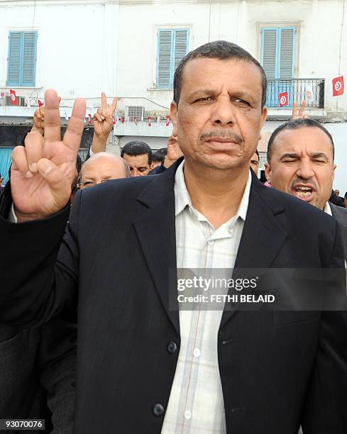 Adnane Hajji, the spokesman last year of a protest movement in the phosphate mining area in southwest Tunisia, flashes a victory sign during a...
