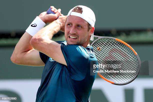 Tennys Sandgren returns a shot to David Ferrer of Spain during the BNP Paribas Open at the Indian Wells Tennis Garden on March 11, 2018 in Indian...