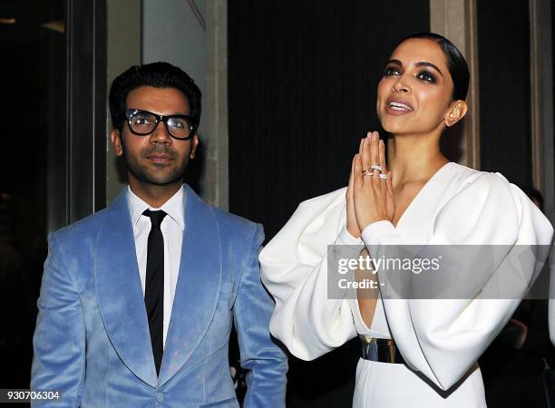 Indian Bollywood actors Rajkumar Rao and Deepika Padukone attend the 'Hello Hall of Fame Awards 2018' in Mumbai on March 11, 2018.