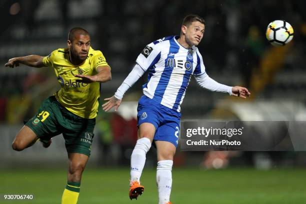 Porto's Brazilian midfielder Otavio in action with Pacos Ferreira's forward Ricardo during the Premier League 2017/18 match between Pacos Ferreira...