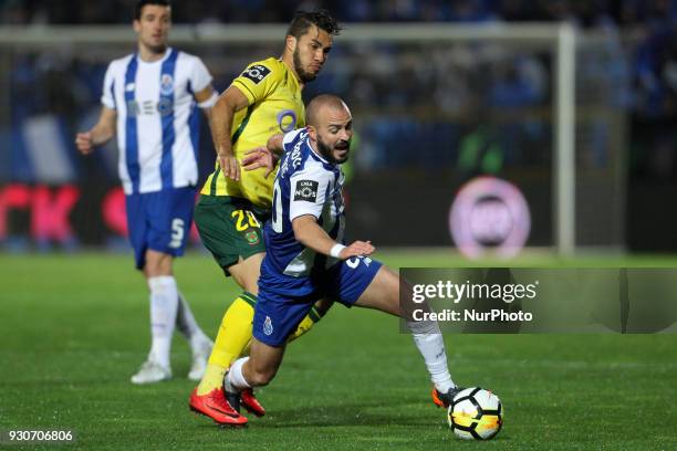 Porto's Portuguese midfielder Andre Andre vies with Pacos Ferreira's forward Luiz Phellype during the Premier League 2017/18 match between Pacos...
