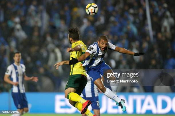 Porto's Algerian forward Yacine Brahimi vies with Pacos Ferreira's forward Luiz Phellype during the Premier League 2017/18 match between Pacos...