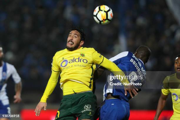 Porto's Cameroonian forward Vincent Aboubakar vies with Pacos Ferreira's Portuguese defender Joao Gois during the Premier League 2017/18 match...