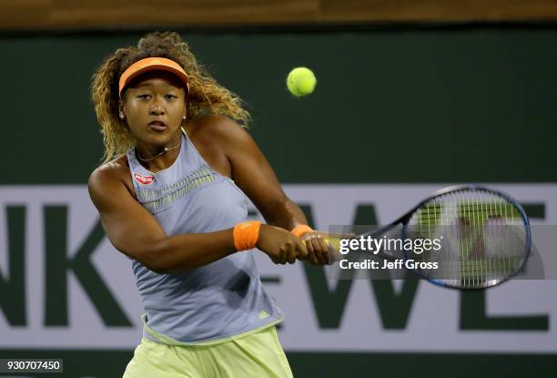 Naomi Osaka of Japan returns a backhand to Sachia Vickery during the BNP Paribas Open on March 11, 2018 at the Indian Wells Tennis Garden in Indian...