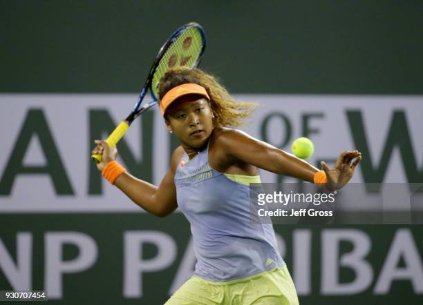 Naomi Osaka of Japan returns a forehand to Sachia Vickery during the BNP Paribas Open on March 11, 2018 at the Indian Wells Tennis Garden in Indian...
