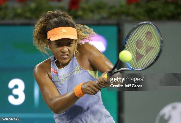 Naomi Osaka of Japan returns a backhand to Sachia Vickery during the BNP Paribas Open on March 11, 2018 at the Indian Wells Tennis Garden in Indian...