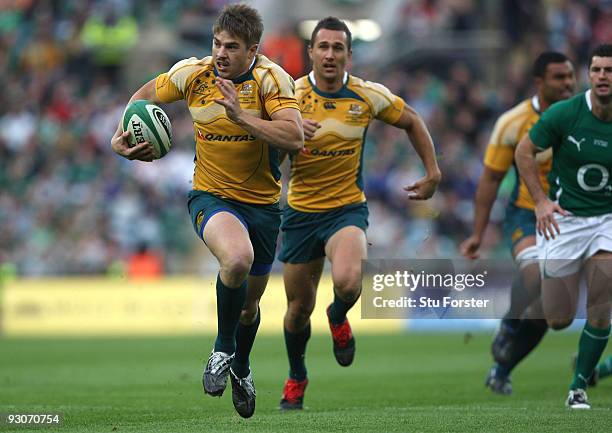 Australia winger Drew Mitchell races away to score the opening try during the Rugby Union International between Ireland and Australia at Croke Park...