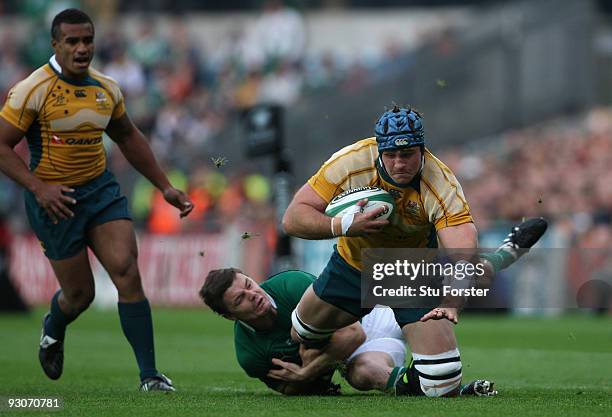 Australia forward James Horwill is tackled by Brian O' Driscoll during the Rugby Union International between Ireland and Australia at Croke Park on...