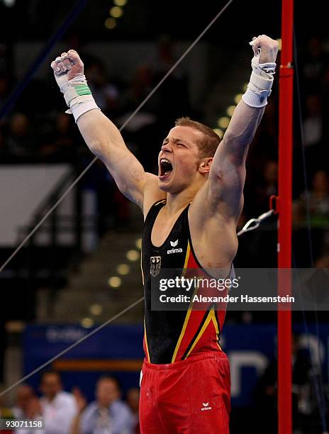 Fabian Hambuechen of Germany reacts after competing at the high bar during the Champions Trophy 2009 at the Porsche Arena on November 15, 2009 in...