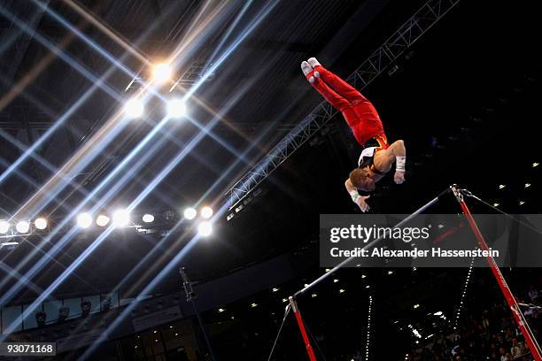 Fabian Hambuechen of Germany competes at the high bar during the Champions Trophy 2009 at the Porsche Arena on November 15, 2009 in Stuttgart,...