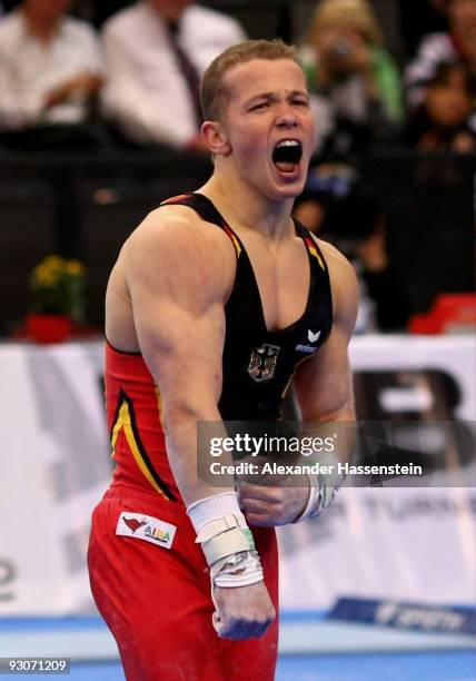 Fabian Hambuechen of Germany reacts after competing at the high bar during the Champions Trophy 2009 at the Porsche Arena on November 15, 2009 in...