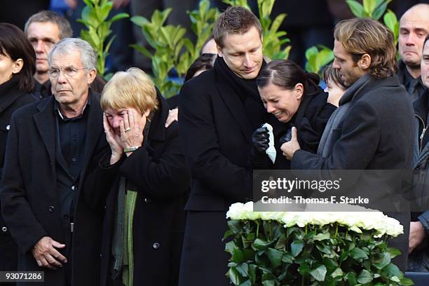 Dirk and Gisela Enke, Robert Enkes parents, Joerg Nebelung, Teresa Enke and Marco Villa during the memorial service prior to Robert Enke's funeral at...