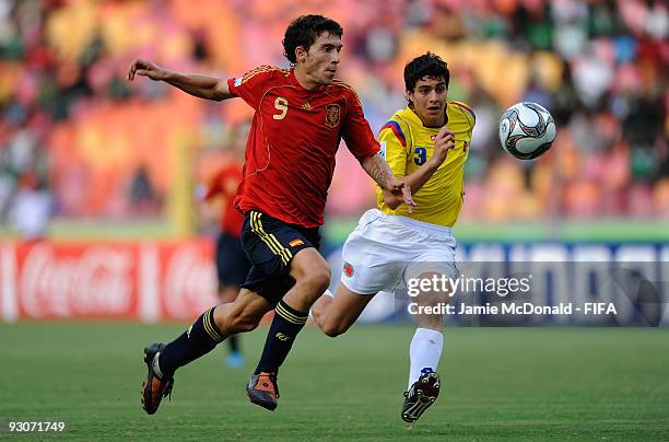 Borja of Spain battles with John Medina of Colombia during the FIFA U17 World Cup 3rd/4th Play off match between Colombia and Spain at the Abuja...