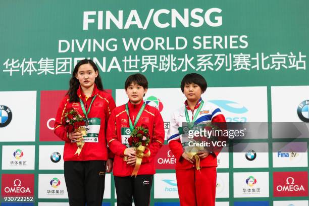 Silver medallist Ren Qian of China, gold medallist Zhang Jiaqi of China and bronze medallist Kim Kuk Hyang of North Korea pose during the medal...