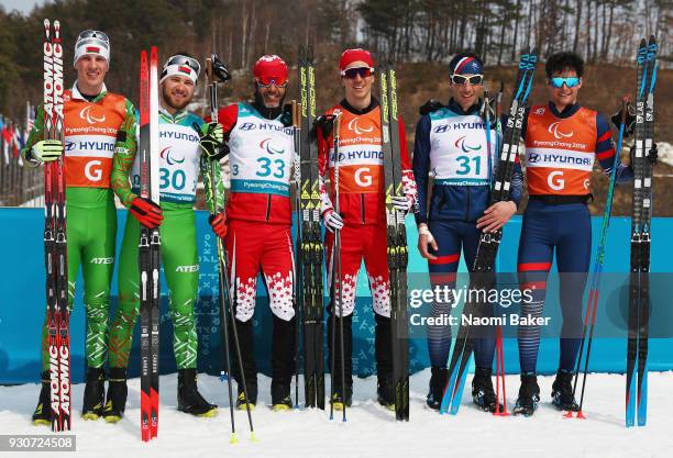 Silver medalists Yury Holub and his guide Dzmitry Budzilovich of Belarus, Gold medalists Brian McKeever and his guide Graham Nishikawa of Canada and...