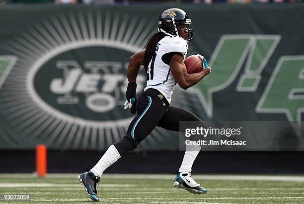 Rashean Mathis of the Jacksonville Jaguars runs with the ball after his interception on the first play of the game against the New York Jets on...