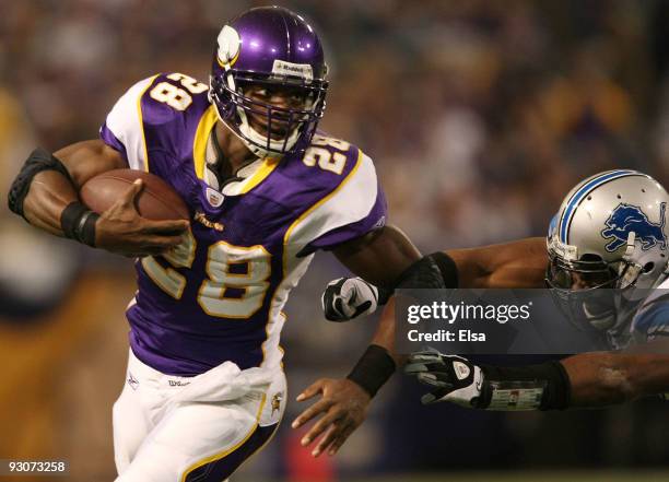 Adrian Peterson of the Minnesota Vikings carries the ball as Julian Peterson of the Detroit Lions defends on November 15, 2009 at Hubert H. Humphrey...