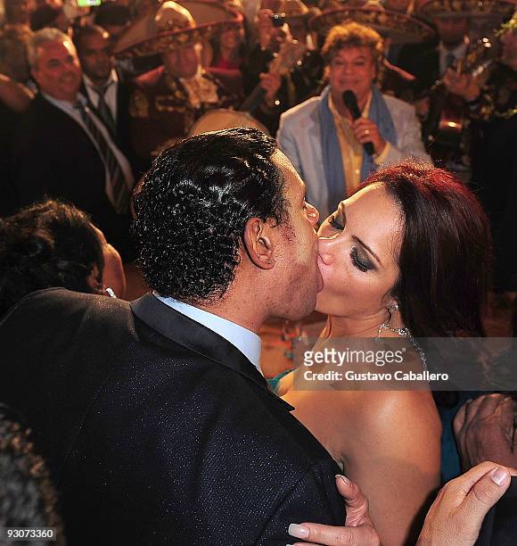Former MLB player Sammy Sosa and Sonia Sosa kiss while Juan Gabriel sings to them at Sammy Sosa's birthday party at Fontainebleau Miami Beach on...