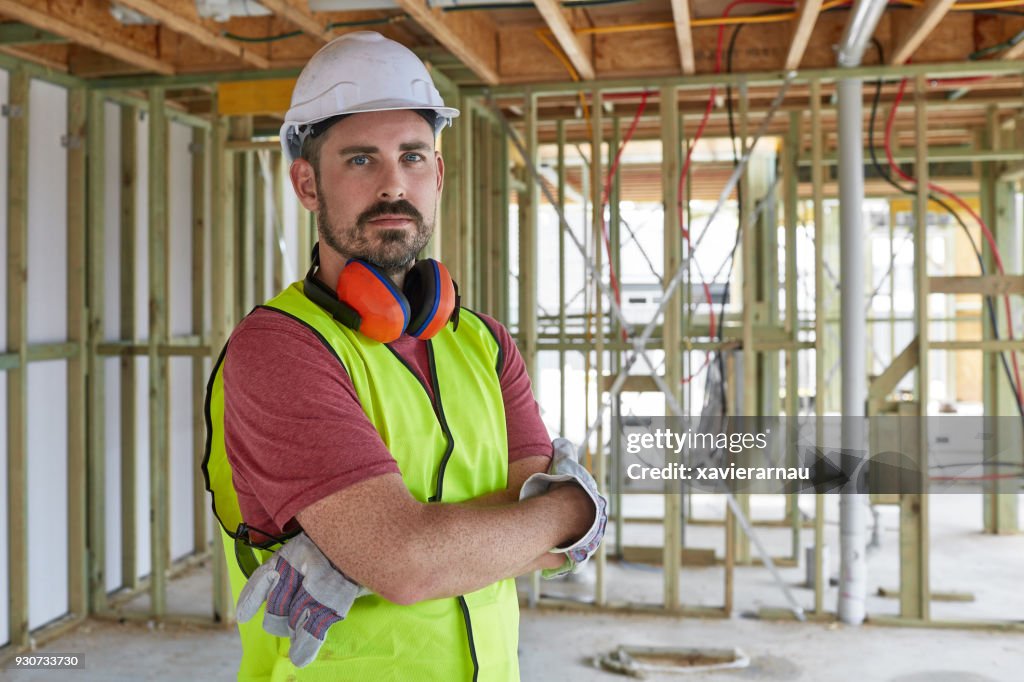 Portrait of construction worker with arms crossed
