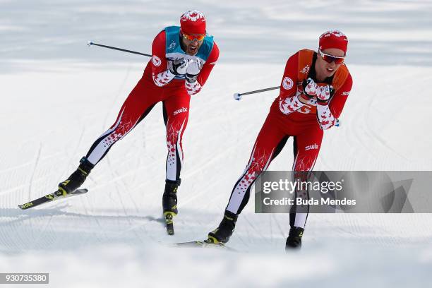 Brian McKeever and his guide Graham Nishikawa of Canada compete in the Men's Cross Country 20km Free, Visually Impaired event at Alpensia Biathlon...