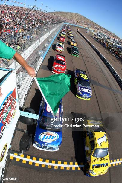 Martin Truex Jr., driver of the Rain-X Chevrolet, takes the green flag to start the NASCAR Sprint Cup Series Checker O'Reilly Auto Parts 500 at...